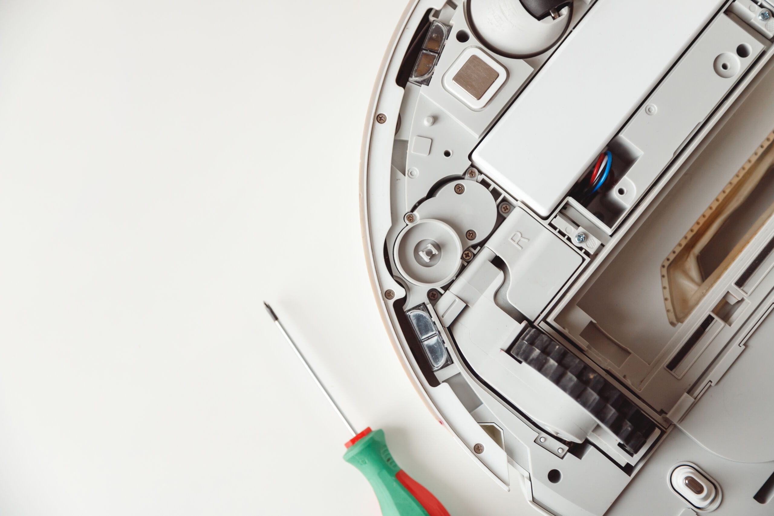 Repair Of The Robot Vacuum Cleaner. Disassembled Robot Vacuum Cleaner.